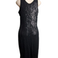 Black sequin dress on a mannequin against a white background