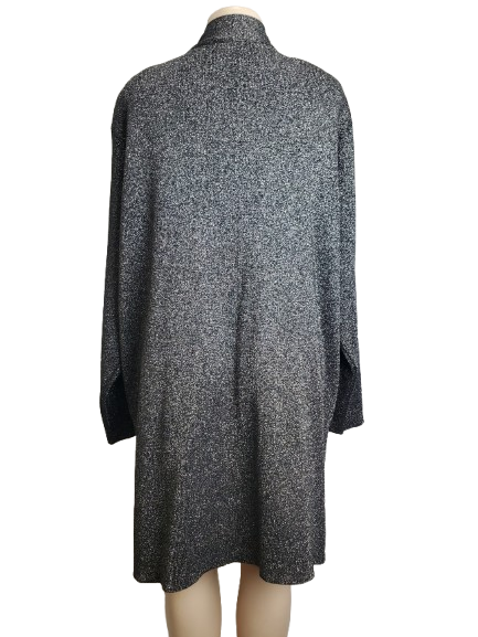 black textured dress on a mannequin against a white background