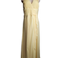 Yellow evening gown on a mannequin against a white background