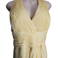 Yellow dress on a mannequin against a white background