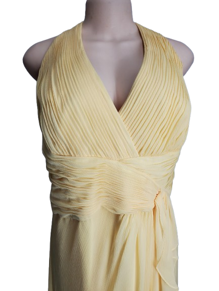 Yellow dress on a mannequin against a white background