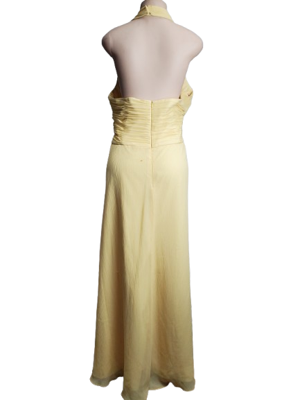 Yellow evening gown on a mannequin against a white background