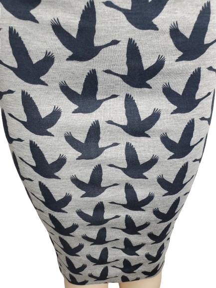 Gray skirt with black bird pattern on a mannequin