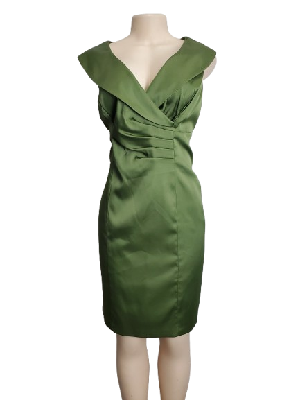 Green dress on a mannequin against a white background