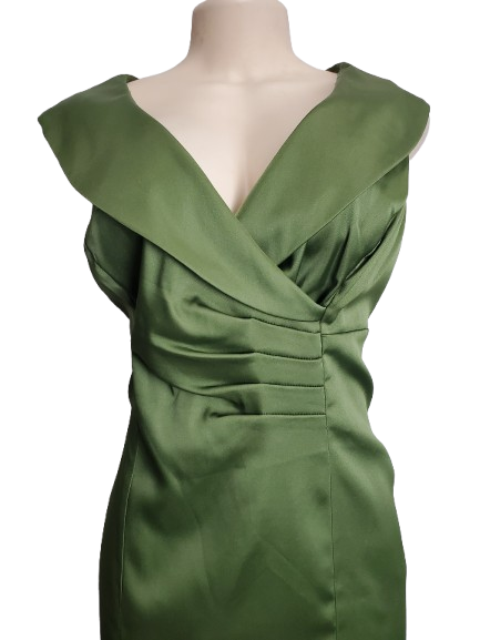 Green dress on a mannequin against a white background