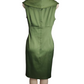 Green dress on a mannequin against a white background