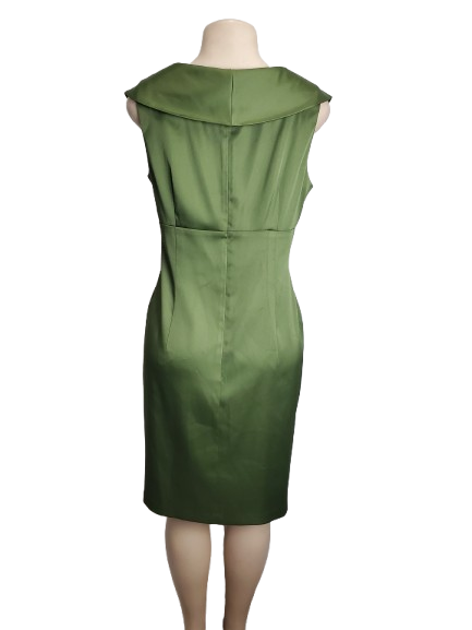 Green dress on a mannequin against a white background