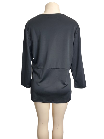 Black long-sleeve top on a mannequin against a white background