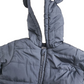 Blue puffer jacket with a hood on a white background