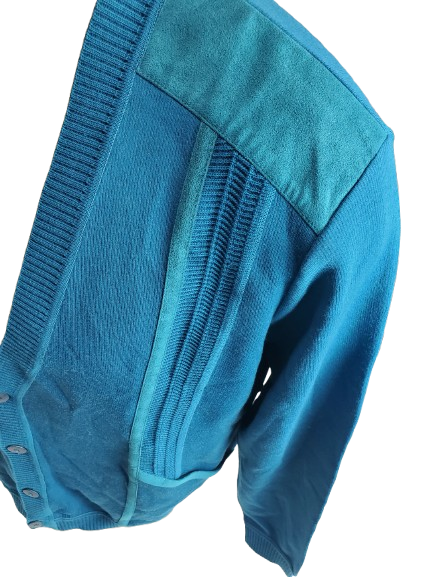 Close-up of a blue button sweater with a  on a white background