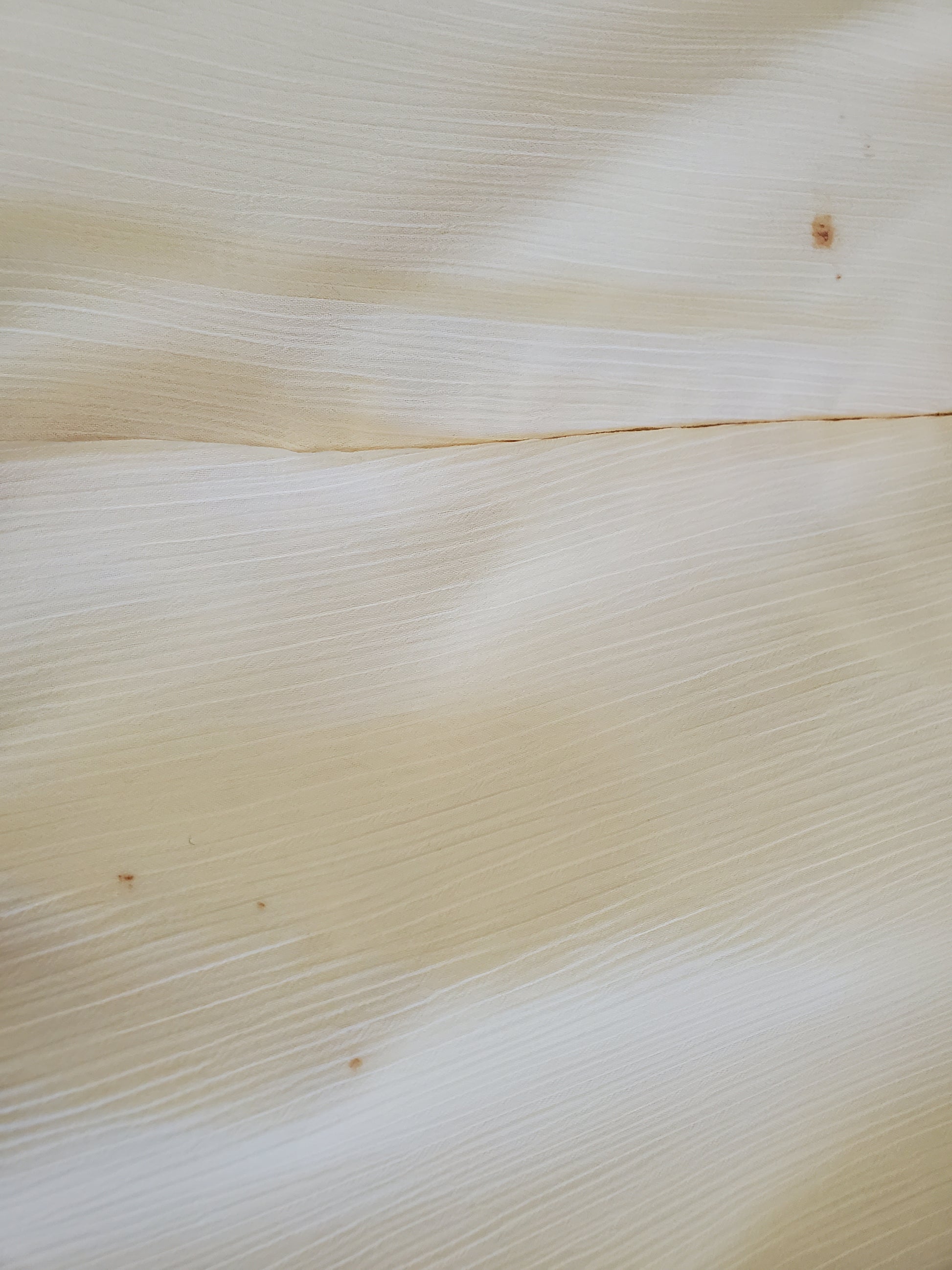 Close-up of a textured beige fabric surface