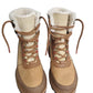 Pair of tan winter boots with white fur lining on a white background