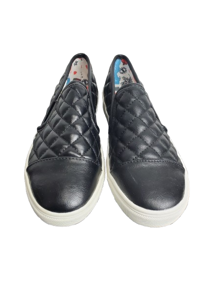 Pair of black quilted slip-on sneakers on a white background