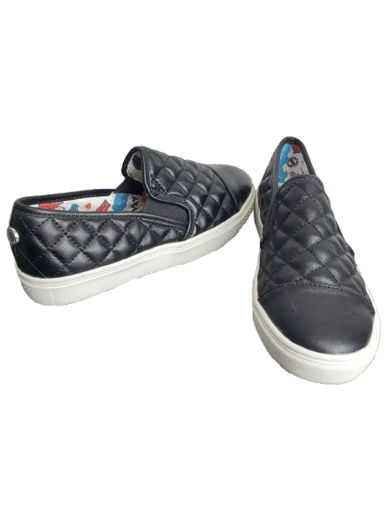 Pair of black quilted slip-on sneakers on a white background