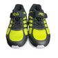 Pair of black and yellow Fila sneakers on a white background