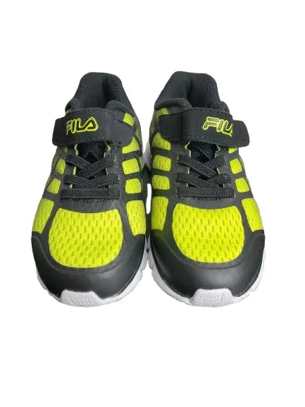 Pair of black and yellow Fila sneakers on a white background