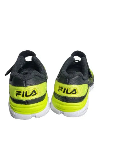 Pair of black and neon green Fila shoes on a white background