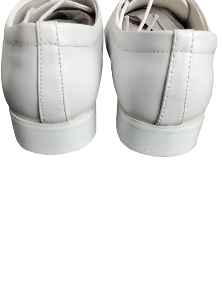 Pair of white sneakers on a white background