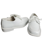 Pair of white easter shoes on a white background