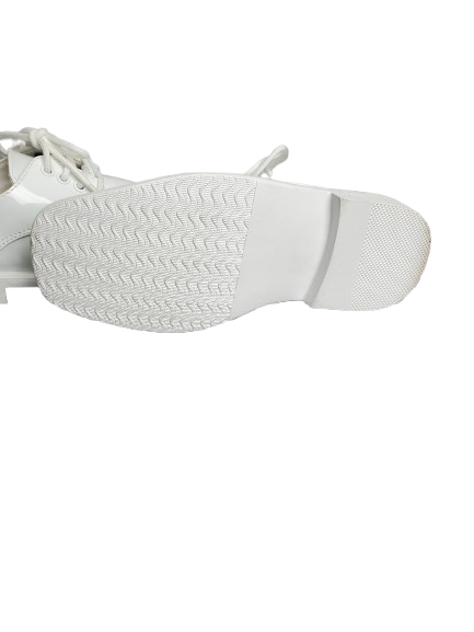 Close-up of a white casual shoes 
sole on a white background