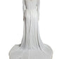 White dress with lace details on a mannequin against a white background