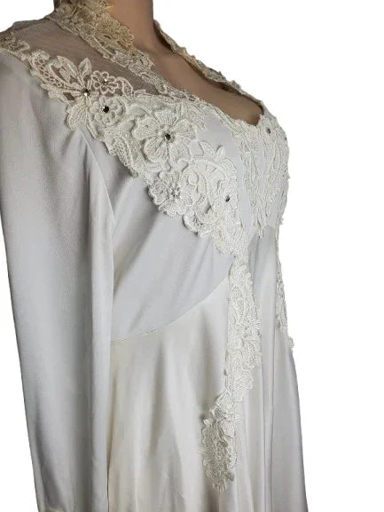 White dress with lace detailing on a white background