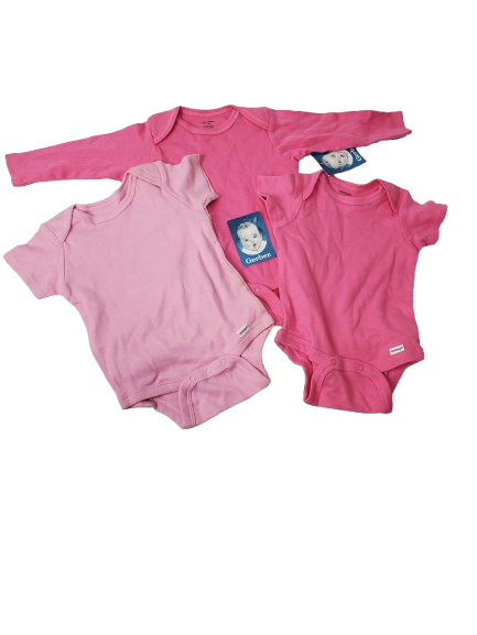 Pink baby onesies with tags on a white background