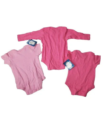 Pink onesies set with tags on a white background