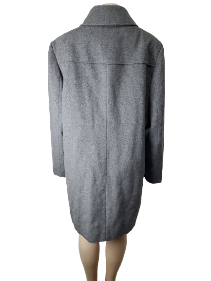 Gray coat on a mannequin against a white background