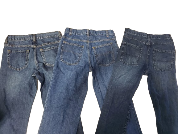 Three pairs of blue jeans stacked on top of each other against a white background