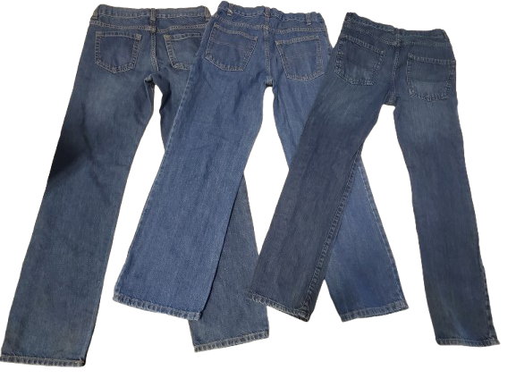 Blue jeans laid out flat on a white background