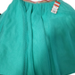 Green skirt with a tag on a white background