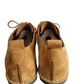 Pair of brown children's shoes on a white background
