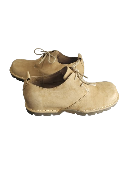 Beige leather shoes on a white background