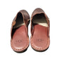 Pair of brown UGG sandals on a white background