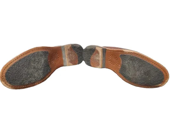 Pair of brown leather shoe soles with gray insoles on a white background