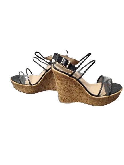 Pair of wedge sandals with cork sole on a white background