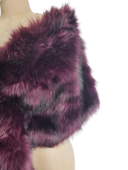 Purple fur shrug worn by a person on a white background