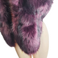 Purple fur stole on a mannequin against a white background