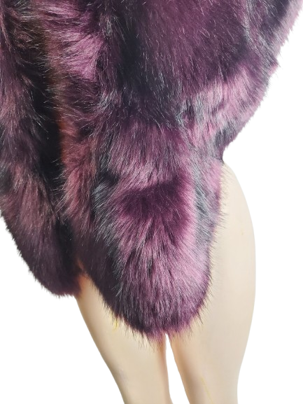 Purple fur stole on a mannequin against a white background