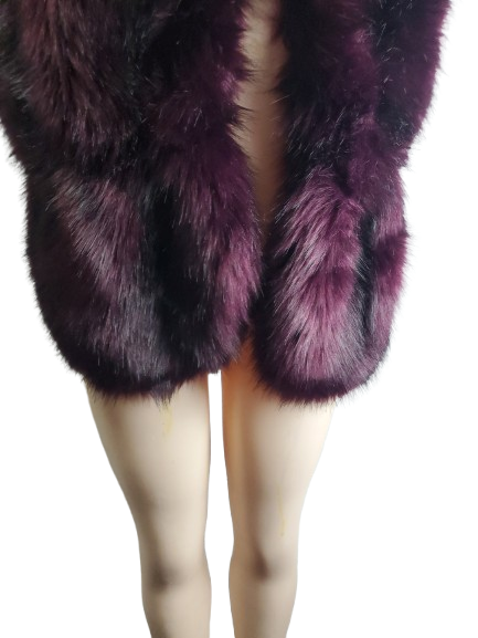 Purple fur stole worn over a person's shoulders on a white background