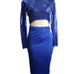 Blue sequin top and skirt set on a mannequin against a white background