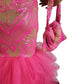 Close-up of a pink sequin dress with matching handbag on a white background