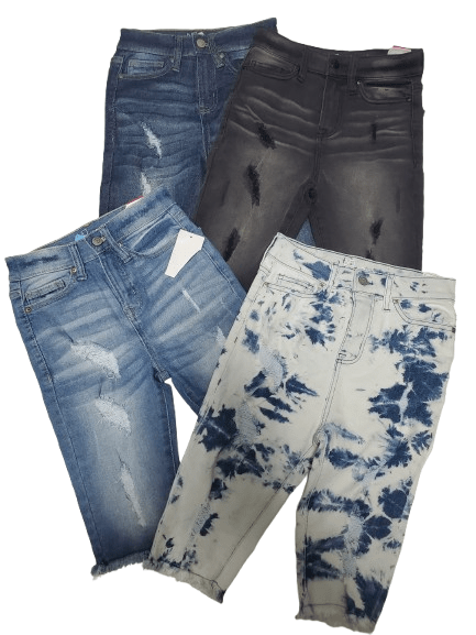 Four pairs of jeans shorts with different styles and colors on a white background