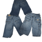 Three pairs of blue jeans on a white background