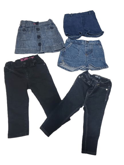 Folded blue jeans on a white background