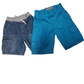 Folded blue shorts on a white background