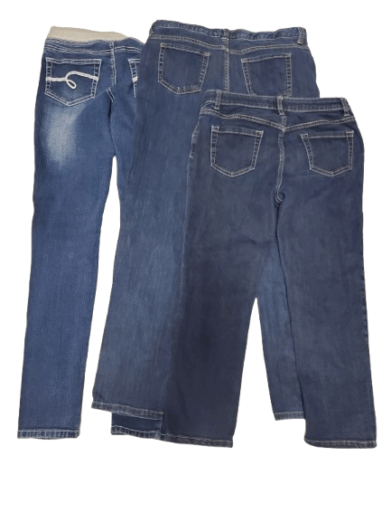 Three pairs of blue jeans stacked on a white background