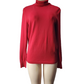 Red turtleneck sweater on a mannequin against a white background