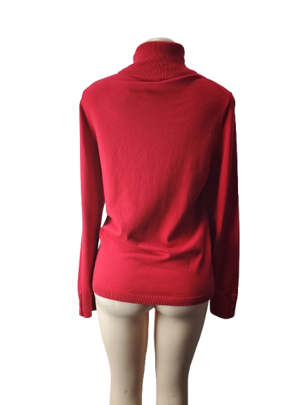 Red sweater on a mannequin against a white background